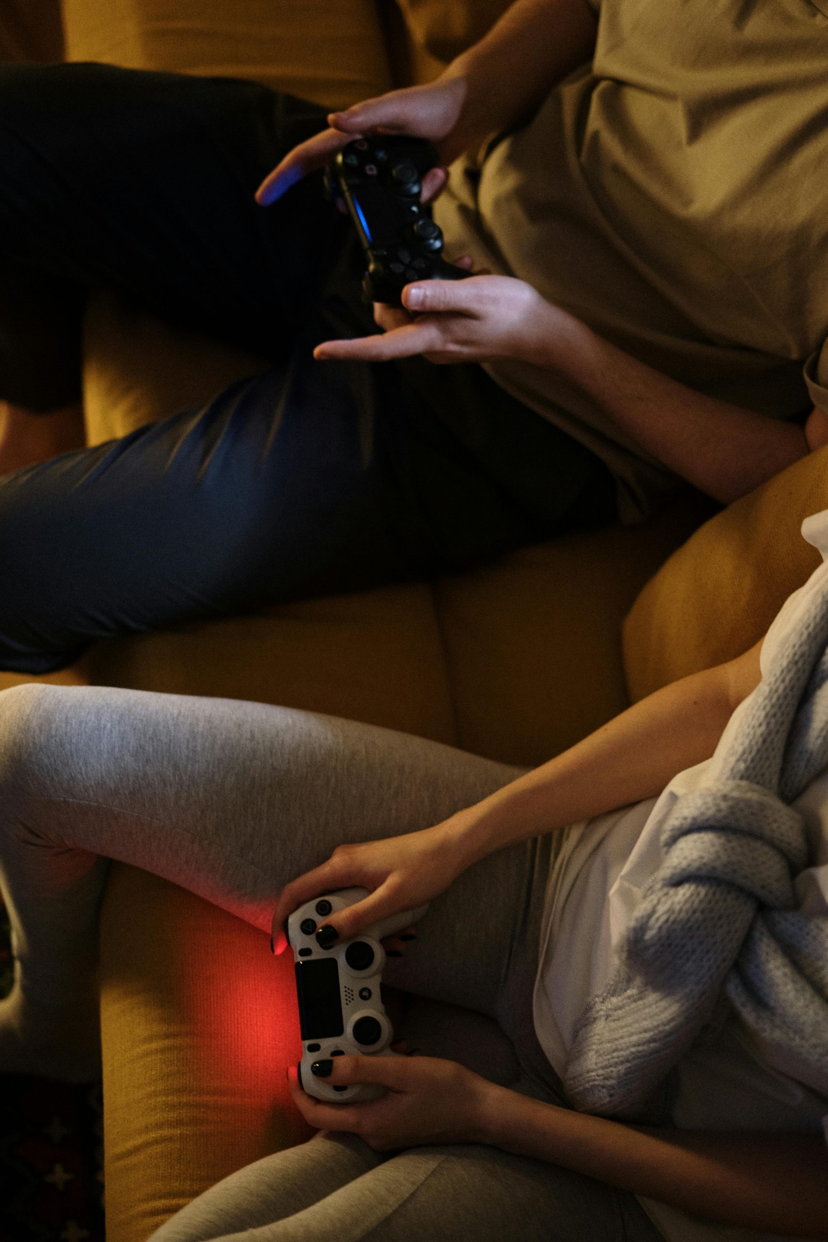 Couple enjoying video games together on a cozy evening at home.